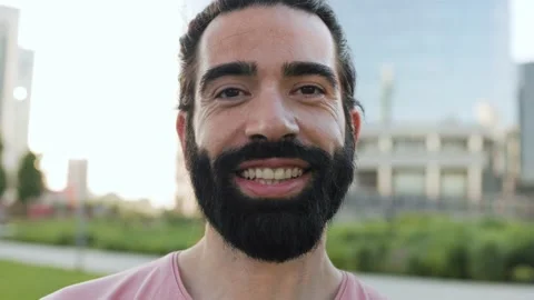 Young hipster man smiling at camera outdoor Video stock 197482668