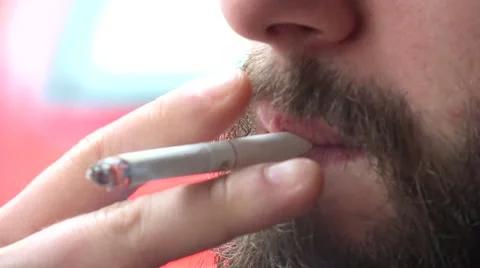 Young hipster man smokes a cigarette - closeup mouth Stock-Footage 51675889
