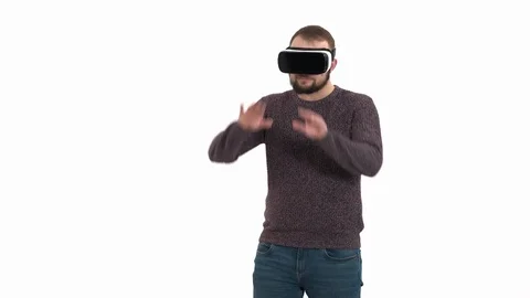 Young hipster man using virtual reality technology gadget. Man surprised by Stock Footage 121198779