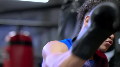 Young Hispanic boxer working out with punching balls Stock Footage 197382450