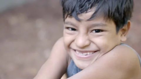Young hispanic boy looking and smiling at camera in Guatemalan village Stock Footage 234361839