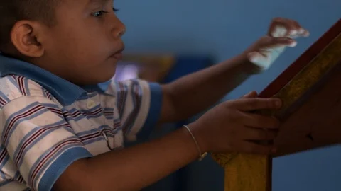 Young hispanic boy using tablet in Guatemalan village Stock Footage 121893708