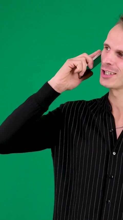 Young Hispanic business man talking on smartphone with solid white background Stock Footage 259548520