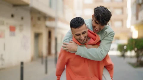 Young hispanic couple smiling confident hugging each other at street Video stock 170634997