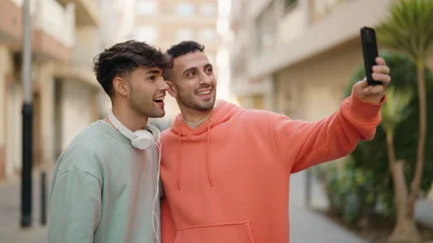 Young hispanic couple smiling confident having video call at street Stock Footage 171043653