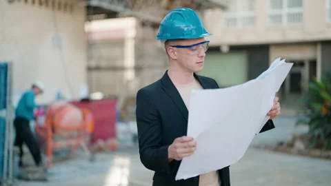 Young hispanic man architect reading blueprints at street Video stock 171789094