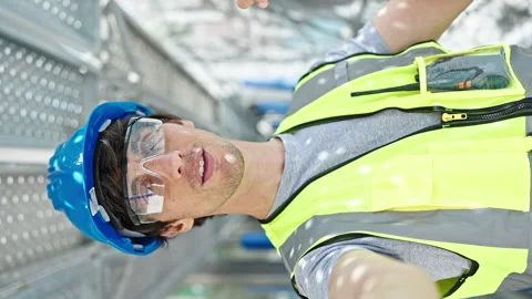 Young hispanic man architect smiling confident having video call at constru.. Stock Footage 247384865