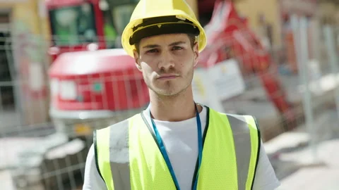 Young hispanic man architect standing with relaxed expression at park Stock Footage 221696934