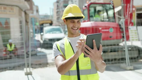 Young hispanic man architect using touchpad at park Video stock 222479765