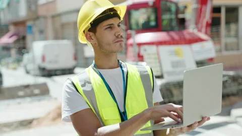 Young hispanic man architect using laptop at park Video stock 229566190