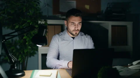 Young hispanic man business worker working overtime at office Video stock 172408445