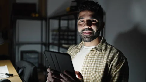 Young hispanic man business worker using touchpad working at office Stock Footage 245046194