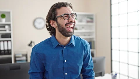 Young hispanic man business worker laughing a lot at the office Video stock 247378322