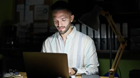 Young hispanic man business worker using laptop sitting on table with arms .. Stock-Footage 247382297