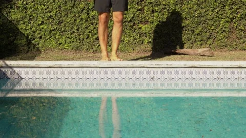 Young Hispanic man dives into the pool with cold water Video stock 202229120