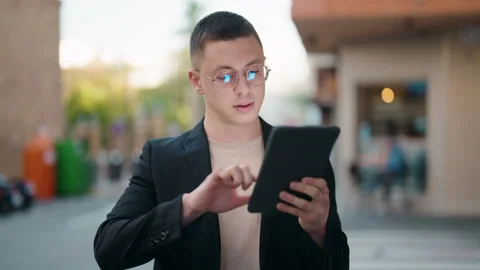 Young hispanic man executive using touchpad at street Stock Footage 171040871