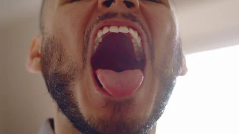 Young hispanic man making funny faces to camera and laughing Stock Footage 84481068