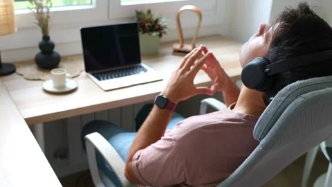 Young hispanic man meditating while teleworking from home Stock Footage 319027701