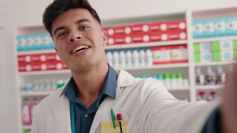 Young hispanic man pharmacist having video call at pharmacy Video stock 220149467