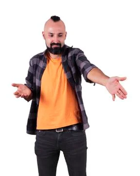 Young hispanic man pointing at something with disdain Stock Photos