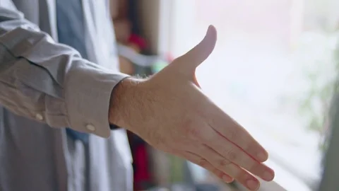 Young hispanic man practicing handshake in front of mirror Stock Footage 84485929