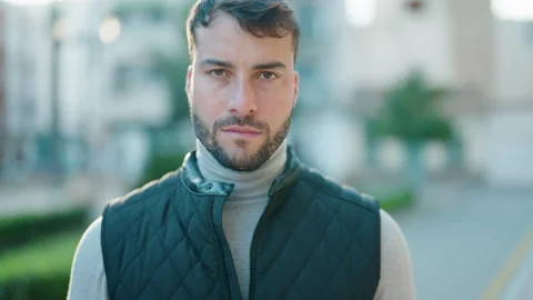 Young hispanic man with serious expression standing at park Video stock 170654893