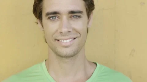 Young hispanic man smiling at camera Stock Footage 7761338