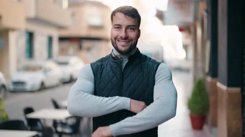 Young hispanic man smiling confident standing with arms crossed gesture at st Video stock 170115153