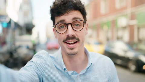 Young hispanic man smiling confident having video call at street Stock Footage 170655242