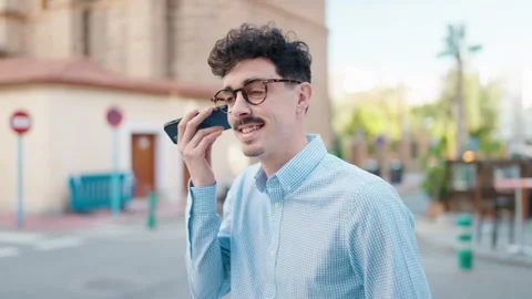 Young hispanic man smiling confident listening audio message by the smartphon Video stock 171050716