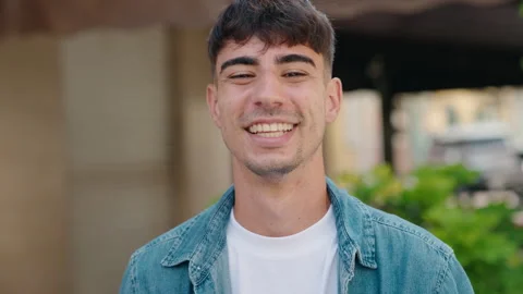 Young hispanic man smiling confident standing at street Stock Footage 206467401