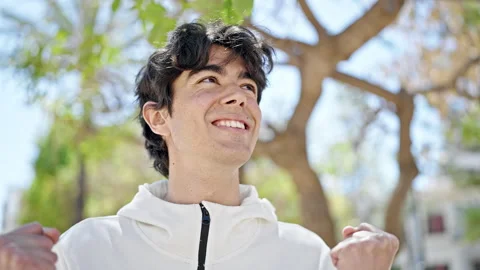 Young hispanic man smiling confident looking to the sky with winner express.. Stock Footage 243478012