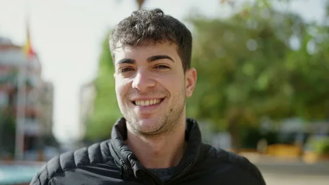 Young hispanic man smiling confident at park Video stock 243483725