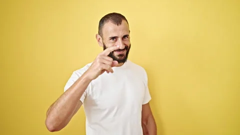 Young hispanic man smiling confident doing telephone gesture with hand over.. Video stock 245020448