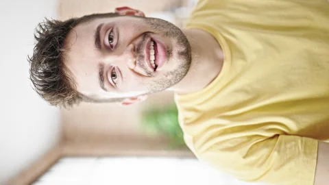 Young hispanic man smiling confident recording video tutorial speaking at d.. Stock Footage 245044833