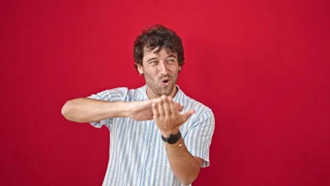 Young hispanic man smiling confident doing spend money gesture over isolate.. Video stock 245045975