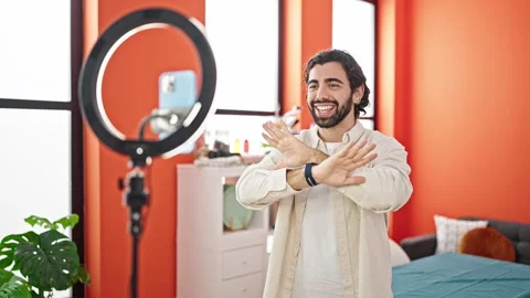 Young hispanic man smiling confident recording video tutorial speaking at d.. Stock Footage 248864581