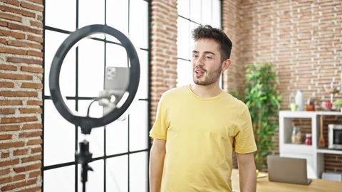 Young hispanic man smiling confident recording video tutorial speaking at d.. Stock Footage 248866678