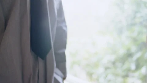 Young hispanic man steps up to mirror and practices handshake Stock Footage 84486358