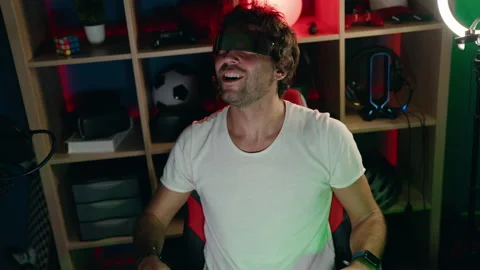 Young hispanic man streamer playing video game using virtual reality glasses  Video stock 220150244