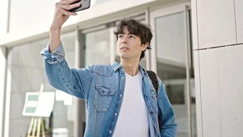 Young hispanic man student smiling confident make selfie by smartphone at u.. Stock Footage 243478519