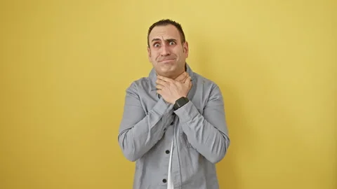 Young hispanic man suffocating in pain, strangled by an invisible force - d.. Stock Footage 268570421