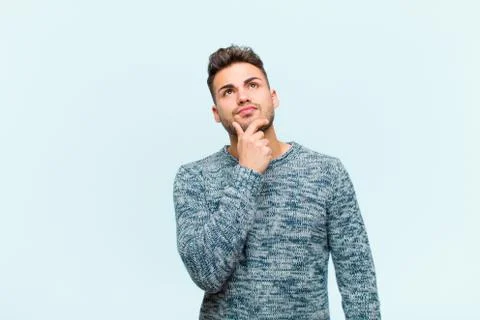 Young hispanic man thinking, feeling doubtful and confused, with different op Stock Photos