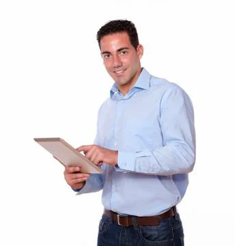 Young hispanic man using his tablet pc Stock Photos
