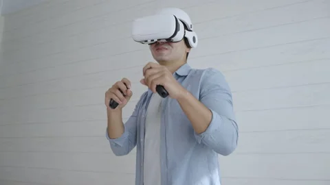 Young Hispanic man wearing virtual reality headset playing boxing game Video stock 166032631