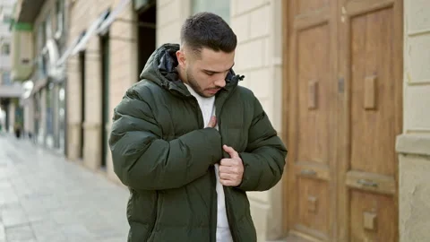 Young hispanic man worried looking for lost wallet at street Video stock 246134275