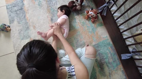 Young hispanic mom playing and exercising with her baby girl Stock-Footage 243175036