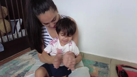 Young hispanic mom playing with her son Stock-Footage 243175708