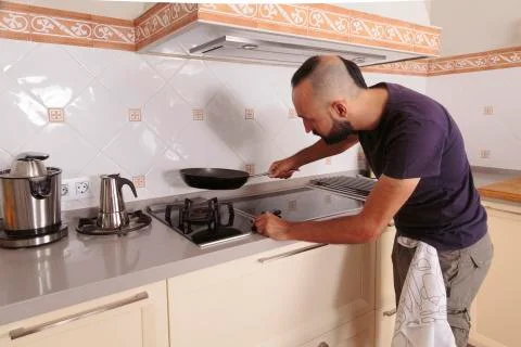 Young hispanic self-sufficient man about to cook Stock Photos