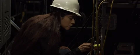 Young Hispanic Technician Adjusts Settings on Equipment  Video stock 149999643